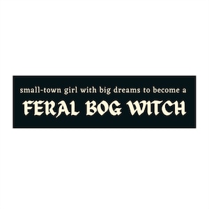 Puede incluir: Pegatina en blanco y negro con el texto "small-town girl with big dreams to become a FERAL BOG WITCH" en una fuente gótica.