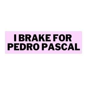 May include: A rectangular sticker with the text "I BRAKE FOR PEDRO PASCAL" in bold black letters on a light pink background. The sticker is designed to be eye-catching and humorous.