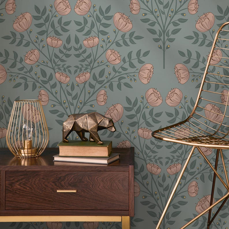 May include: A teal wallpaper with a floral pattern of pink peonies and green leaves. A gold metal chair and a gold metal bear sculpture are in the foreground.