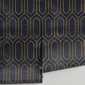 May include: Black and gold geometric wallpaper with a repeating pattern of octagons and hexagons. The wallpaper is rolled up and partially unrolled, showing the pattern.
