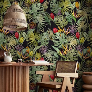 May include: A striking wallpaper showcasing a dense tropical jungle scene. The design incorporates large green leaves, red and yellow flowers, and diverse tropical plants set against a black backdrop. A woven pendant light hangs above the scene.