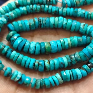 May include: Strands of turquoise gemstone beads. The beads are a vibrant turquoise color with variations in shade, and are faceted to catch the light. The beads are strung together, forming a necklace or bracelet.
