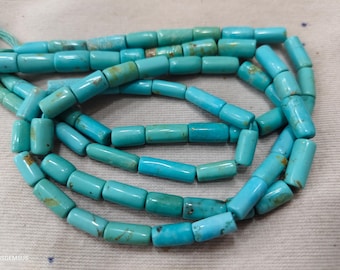 May include: A strand of cylindrical turquoise beads featuring a vibrant blue-green color with natural brown matrix inclusions. The beads are strung together in a continuous loop, showcasing a smooth, polished finish and consistent tubular shape.