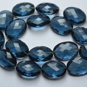 2 matched pairs Superfijne kwaliteit London Blue hydrokwarts gefacetteerde ovale brioletten Grootte: 13 x 18 mm