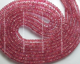 May include: A strand of pink tourmaline beads, faceted and with a square shape. The beads are strung on a clear thread and are approximately 4mm in size.