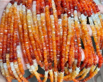 May include: Strands of orange, red, and white gemstone beads. The beads are small, square-cut, and strung together, creating a layered effect. The color gradient ranges from light orange to deep red.