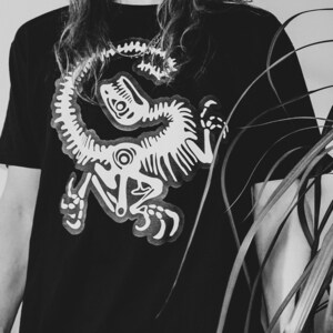dino skeleton • t-shirt