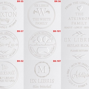 May include: Ten white rubber stamps with different designs and text. The stamps are for bookplates and feature text such as "The Brixton Family", "The White Family", "The Atkinson Family", "Jackie Lee", "Alexander", "Skylar Sloan", "The Blackwell Family", "Alex Mitchell", and "Addison".