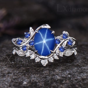 Vintage Oval Cut Star Blue Sapphire Engagement Ring Set Unique September Birthstone Blue Sapphire Ring Art Deco Leaf Nature Inspired Ring 2pcs Bridal Ring Set