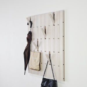 Wall coat rack. Covered with white oil wax