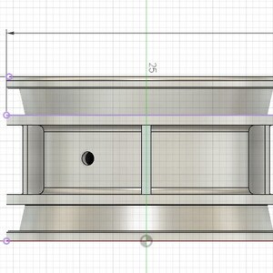 May include: A silver metal object with a round top and a rectangular middle section. The object is 42 inches wide and 24.662 inches tall. The top and bottom of the object are rounded.