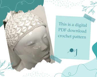 May include: A crocheted head covering in a light neutral colour is displayed on a mannequin head. The head covering has an open, net-like design. Text on a blue background reads: "This is a digital PDF download crochet pattern."