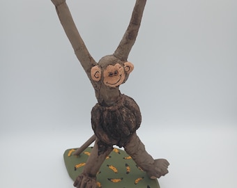 Gall Monkey with banana base Woodcarving
