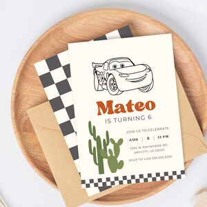 May include: A white invitation card with a black and white checkered border. The card features a black and white line drawing of a red race car with a smiling face. The text "Mateo is turning 6" is in orange and black letters. The text "Join us to celebrate" is in black letters. The date and time of the event are listed as "Aug 8 | 12 PM". The address is "1234 W Anywhere Rd Anycity, US S5555". The RSVP information is "RSVP to Lisa 555.555.5555".
