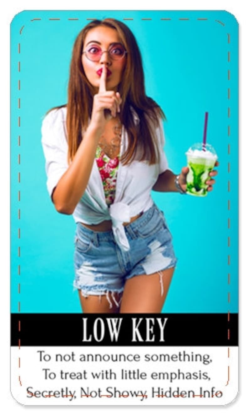 May include: A woman in a white shirt and denim shorts is holding a green smoothie and making a shushing gesture with her finger to her lips. The text "LOW KEY" is written in black letters on a white background. The text below reads "To not announce something, To treat with little emphasis, Secretly, Not Showy, Hidden Info."