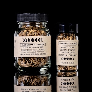 May include: Two glass jars filled with patchouli root, labeled with text about magical properties like money draw and sexual power. The jars have black lids and are set against a black background.