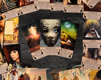 May include: A collection of colorful tarot cards with images of Egyptian gods, goddesses, and symbols. The cards are laid out on a wooden surface. The cards feature titles such as "Awakening", "Soul Mission", "Legacy", and "Back to Life".