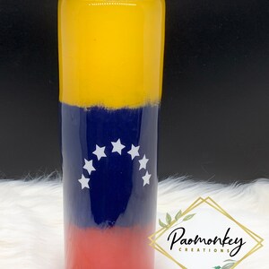 May include: A yellow, blue, and red stainless steel tumbler with a white star design. The tumbler features the flag of Venezuela.