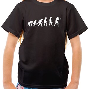 May include: Black t-shirt with a white graphic of the evolution of man, ending with a boxer.