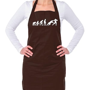 May include: Brown apron with a white design of the evolution of man, ending with a man playing rugby.