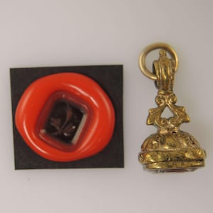 Georgian gilt cased seal with a FLOWER intaglio c1820