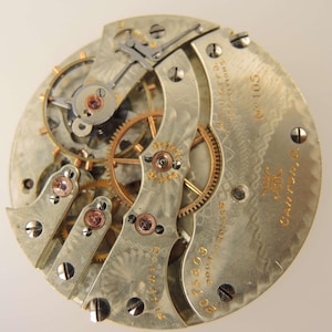 Movimiento de reloj de bolsillo Hampden No 105 de 21 rubíes, tamaño 16, circa 1905.