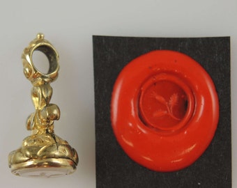 Victorian gilt and stone set seal with a Flower intaglio c1850