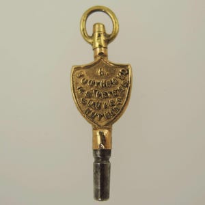 Viktoriansk reklamfickurnyckel. Boothroyd, Ruthin ca 1880.