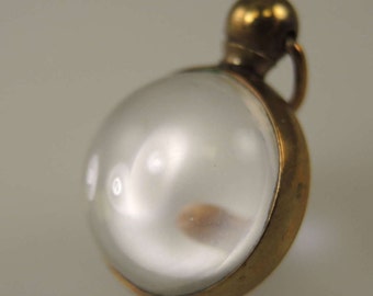 Gilt and glass ball locket c1890