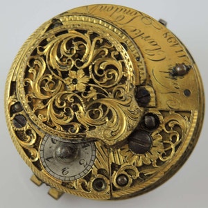 May include: A gold pocket watch with intricate floral engravings and the inscription "James Clark 1783 London".