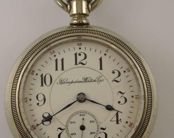Reloj de bolsillo de 18 piezas con 21 joyas, de grado ferroviario de Hampden, c1909