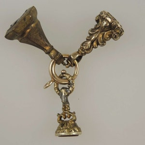 Three Victorian gilt seals with intaglios and gold bolt ring c1850