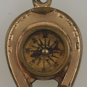 Victorian gilt metal compass fob with horse motifs c1890