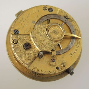 May include: A gold pocket watch with intricate engravings and the inscription "J. Edwards, Esq."
