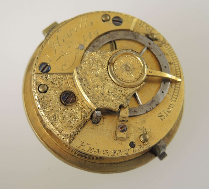 May include: A gold pocket watch with intricate engravings and the inscription "J. Edwards, Esq."