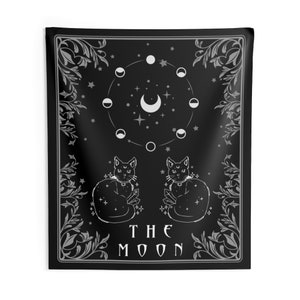 May include: Black and white tapestry featuring a tarot card design with the text "THE MOON". The card depicts two cats sitting back to back, a crescent moon, and a circle of moon phases.