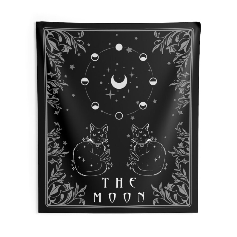 May include: Black and white tapestry featuring a tarot card design with the text "THE MOON". The card depicts two cats sitting back to back, a crescent moon, and a circle of moon phases.