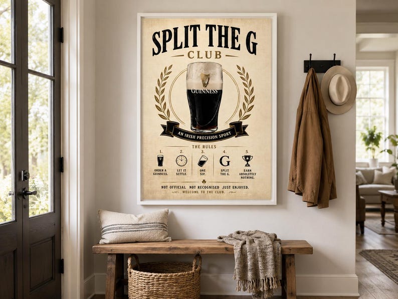 May include: A framed print with the text "SPLIT THE G CLUB" and an illustration of a Guinness pint. The print includes the rules of the club and is displayed above a wooden bench with a pillow and basket.