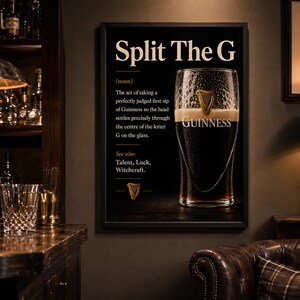 May include: A framed black and white Guinness advertisement with the text "Split The G" and a definition. The image features a pint of Guinness and the Guinness logo. The background includes a bar setting with bottles and glasses.