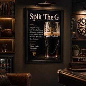 May include: A framed black sign with the text "Split The G" and a definition of the perfect Guinness sip. A pint of Guinness is in the center. The image is in a dark, cozy bar setting with a pool table and dartboard.