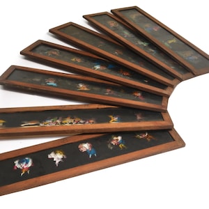 Seven large wood framed glass magic lantern slides, Victorian, hand tinted, circa 1860