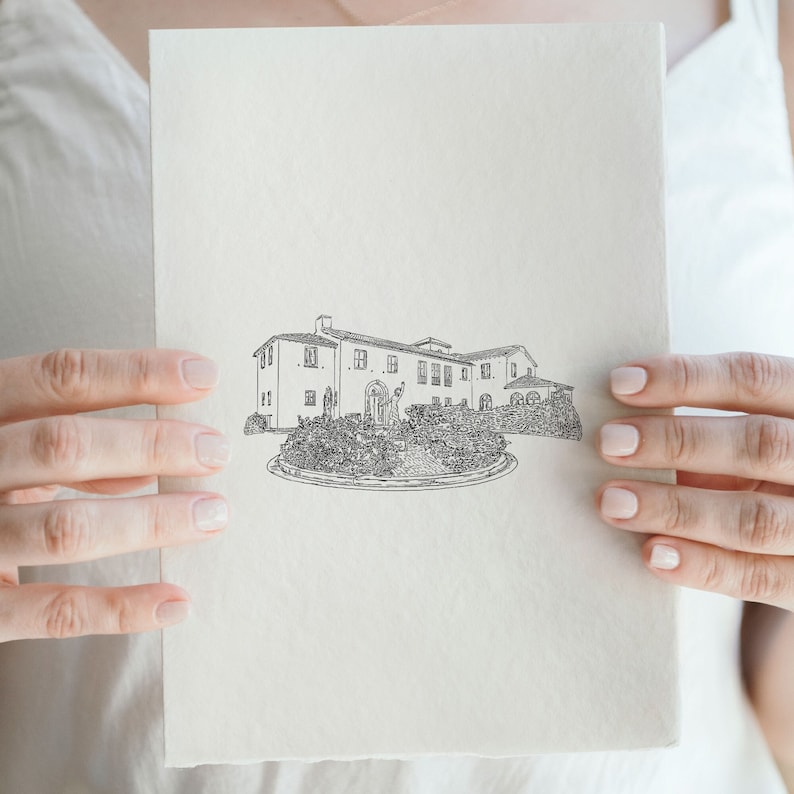 May include: A black and white line drawing of a large house with a fountain in front of it. The drawing is on a white piece of paper.