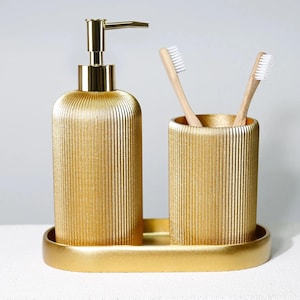 Conjuntos de accesorios de baño Lydia con dispensador de jabón, portacepillos y bandeja de baño