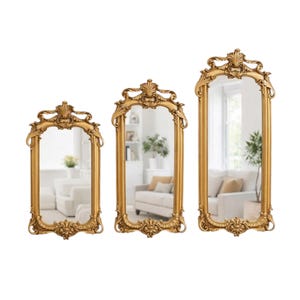 May include: A set of three rectangular wall mirrors with ornate gold-colored frames. Each mirror features intricate scrollwork and floral-inspired carvings at the top and bottom edges, with a polished reflective surface encased in a metallic gold finish.