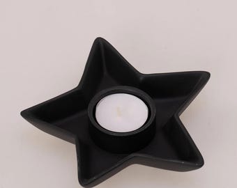 Portavelas de resina negra hecho a mano con forma de estrella: elegante decoración para el hogar.