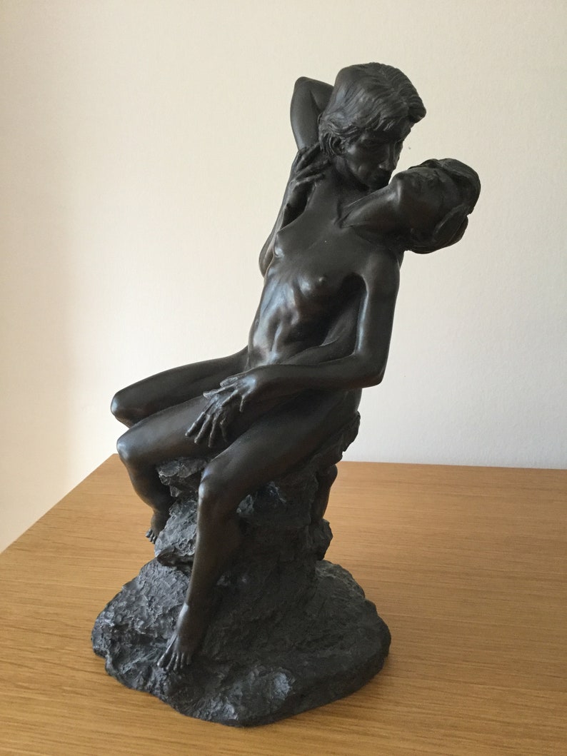 Sculpture of a Naked Couple Embracing on a Rock base. Foundry image 1