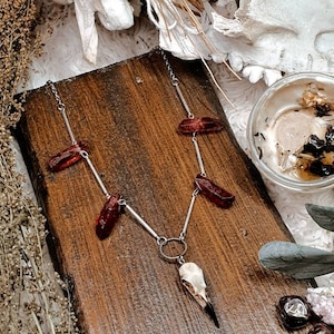 ᚨylgija Necklace with red quartz and raven skull