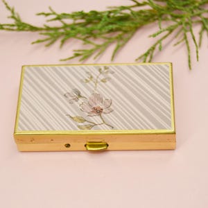 Gold pocket pill box with elegant and compact design