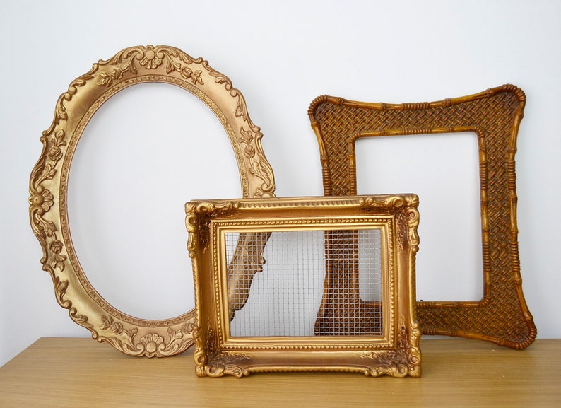 May include: Three ornate gold picture frames, one oval, one square and one rectangular with a wire mesh insert.