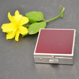 Gold pocket pill box with elegant and compact design